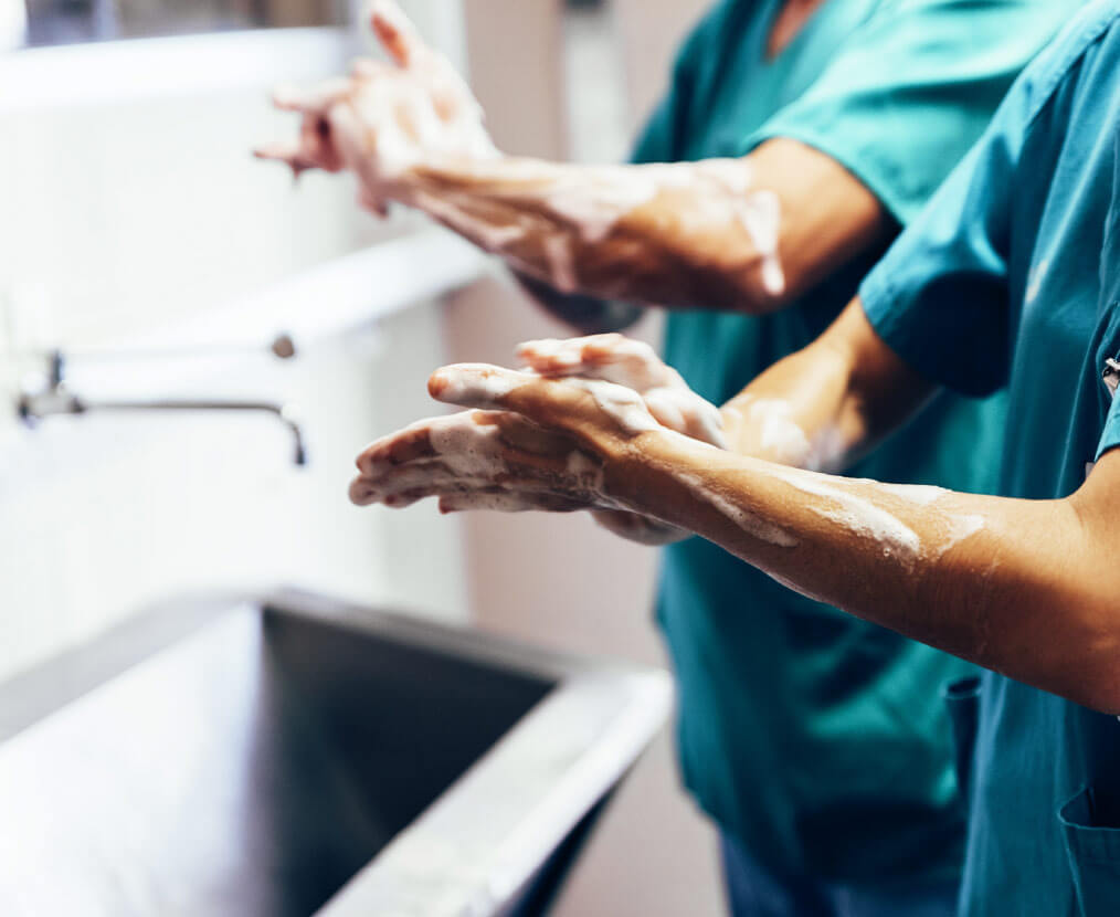 medical staff wearing scrub suit and washing their hands