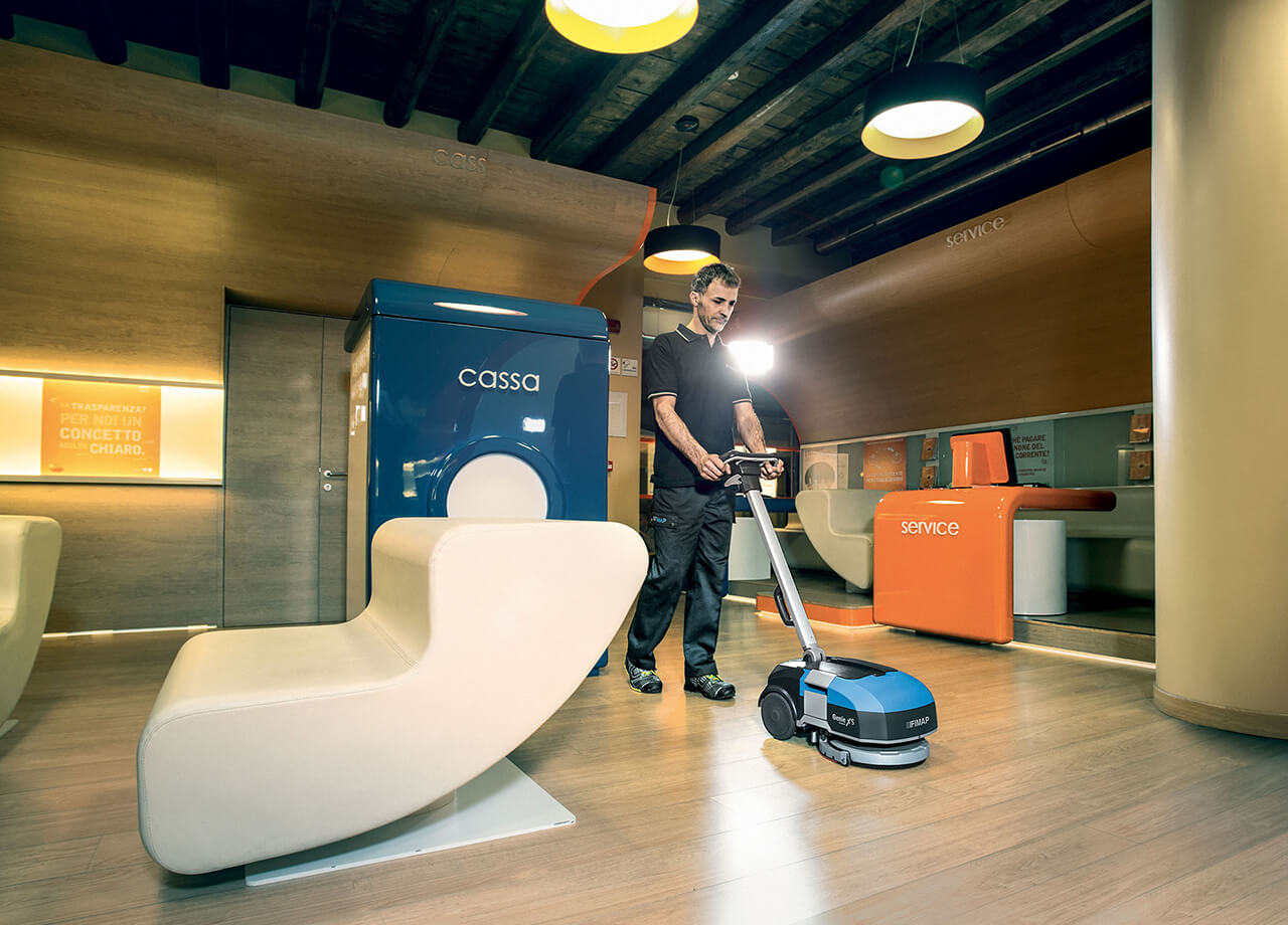 Male Cleaning Office Floor With Parc Global Genie XS