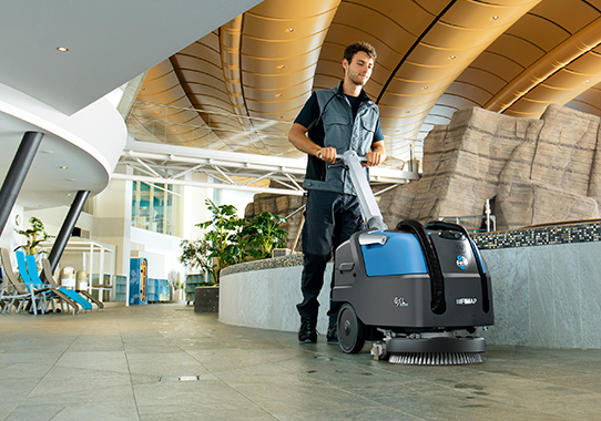 male using gxl floor cleaning machine to clean shopping centre