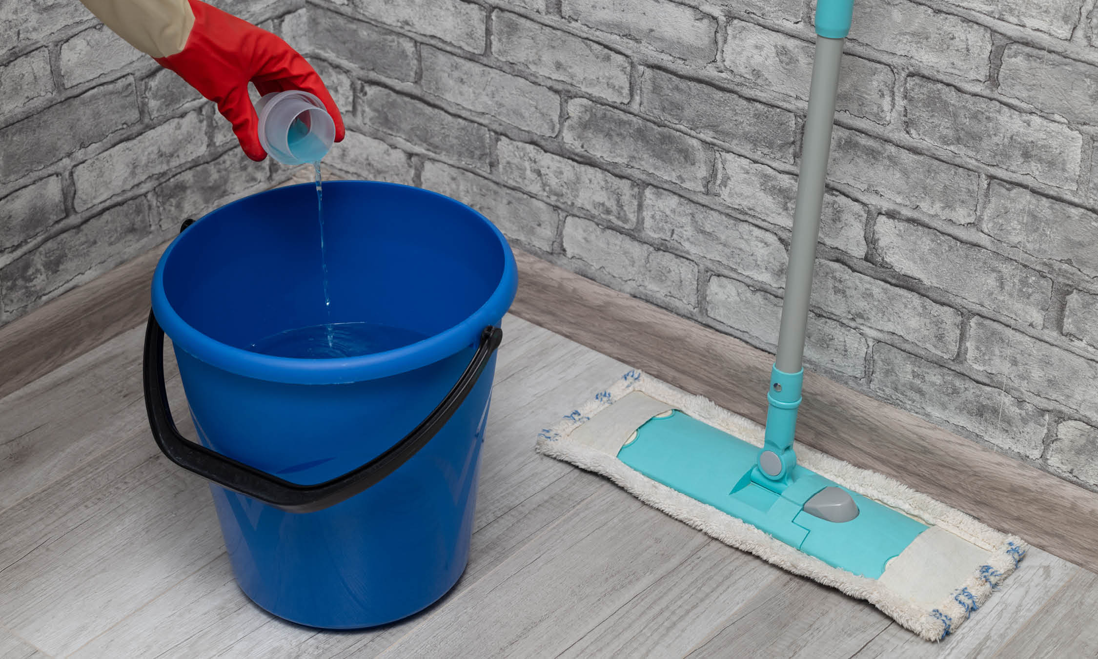 mop and bucket with chemical cleaning solution